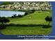 Scenic view of the Clermont National Golf Course with lush greenery and a tranquil lake at 1180 Mesa Verde Ct, Clermont, FL 34711