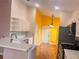 Modern kitchen featuring stainless appliances, white cabinets, and an eat in bar at 1180 Mesa Verde Ct, Clermont, FL 34711