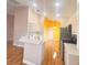 Stylish kitchen showcasing modern appliances, light countertops, and wood flooring at 1180 Mesa Verde Ct, Clermont, FL 34711