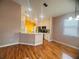 Open kitchen featuring stainless steel appliances, tile backsplash, and a breakfast bar overlooking the dining area at 1180 Mesa Verde Ct, Clermont, FL 34711