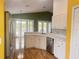 Modern kitchen featuring white cabinets, stainless steel appliances, and granite countertops at 1180 Mesa Verde Ct, Clermont, FL 34711