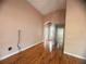 Open living room with sleek wood floors and neutral-toned walls at 1180 Mesa Verde Ct, Clermont, FL 34711