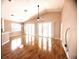 Bright living room with wood flooring, high ceilings, and sliding glass doors at 1180 Mesa Verde Ct, Clermont, FL 34711