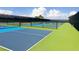 Well-maintained outdoor pickleball courts with vibrant blue and green surfaces, perfect for recreational play at 1180 Mesa Verde Ct, Clermont, FL 34711