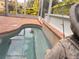 Close-up of the beautiful kidney-shaped pool with tile accents, ideal for unwinding and enjoying the outdoors at 1180 Mesa Verde Ct, Clermont, FL 34711
