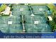 Aerial view of eight Har-Tru clay tennis courts with a pavilion at 1180 Mesa Verde Ct, Clermont, FL 34711