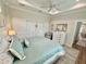 Comfortable bedroom with tray ceilings, ceiling fan, and lots of closet space at 12110 Grand Oak Ln, Oxford, FL 34484