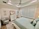 Bedroom with tray ceilings, lots of natural light, and comfortable decor at 12110 Grand Oak Ln, Oxford, FL 34484