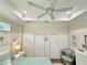 Bedroom with tray ceilings, lots of closet space, and decorative decor at 12110 Grand Oak Ln, Oxford, FL 34484