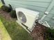 Exterior shot of HVAC unit of home, surrounded by landscaping at 12110 Grand Oak Ln, Oxford, FL 34484