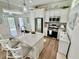 Well-lit kitchen with an island, granite countertops, and stainless steel appliances at 12110 Grand Oak Ln, Oxford, FL 34484