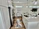 Bright kitchen with granite countertops, stainless appliances, and an island with bar seating at 12110 Grand Oak Ln, Oxford, FL 34484