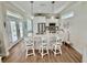 Charming kitchen with a large island, granite countertops, and stainless steel appliances at 12110 Grand Oak Ln, Oxford, FL 34484