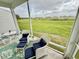 Relaxing screened porch with a picturesque outdoor view at 12110 Grand Oak Ln, Oxford, FL 34484