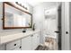 Modern bathroom featuring a vanity with a large mirror and a shower at 1224 Ballesteros Dr, The Villages, FL 32162