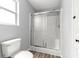 Clean and bright bathroom with a glass-enclosed shower and updated fixtures at 1224 Ballesteros Dr, The Villages, FL 32162