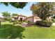 Charming single-story home with mature landscaping and a well-manicured lawn, creating great curb appeal at 12947 Se 97Th Terrace Rd, Summerfield, FL 34491