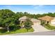 Charming single-story home featuring a manicured lawn and mature landscaping at 12947 Se 97Th Terrace Rd, Summerfield, FL 34491