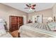 Comfortable main bedroom with wood floors and a spacious wardrobe at 12947 Se 97Th Terrace Rd, Summerfield, FL 34491
