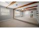 Bright living room featuring exposed beams, neutral paint, and ample natural light at 1301 Cambridge Dr, Leesburg, FL 34748