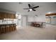 Open-concept living room with a kitchen bar area and a dining area at 1301 Cambridge Dr, Leesburg, FL 34748