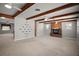Cozy living room with exposed beam ceiling, fireplace, and open layout at 1301 Cambridge Dr, Leesburg, FL 34748