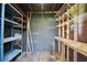 The interior of the shed shows shelves and a workbench at 1301 Cambridge Dr, Leesburg, FL 34748
