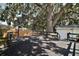 Expansive backyard deck with railing, ideal for outdoor entertaining and relaxation at 1301 Cambridge Dr, Leesburg, FL 34748