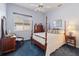 Bedroom with blue carpet, dark wood furniture, and window with blinds at 1351 Legendary Blvd, Clermont, FL 34711