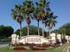 Welcoming entrance to Legends Golf & Country Club, featuring lush landscaping and a prominent sign at 1351 Legendary Blvd, Clermont, FL 34711