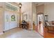 Elegant foyer with tile flooring, high ceilings, decorative lighting, and a welcoming entrance at 1351 Legendary Blvd, Clermont, FL 34711