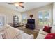 Inviting living room featuring neutral tones, plantation shutters, and a cozy seating arrangement at 1351 Legendary Blvd, Clermont, FL 34711