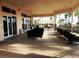 Inviting covered patio featuring comfortable seating with views of the community at 1351 Legendary Blvd, Clermont, FL 34711