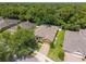 Beautiful home with lush lawn, brick driveway, mature trees, and a fenced backyard at 1556 Blue Grass Blvd, Deland, FL 32724