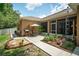 Back patio area with an outdoor grill, table, chairs, and lush landscaping at 1556 Blue Grass Blvd, Deland, FL 32724