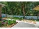 Spacious backyard featuring a manicured lawn, patio area, and privacy fence at 1556 Blue Grass Blvd, Deland, FL 32724