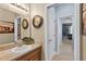 Inviting bathroom features a vanity with marble countertop, accent lighting, and a view of living spaces at 1556 Blue Grass Blvd, Deland, FL 32724