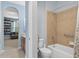 Well-appointed bathroom with tub, shower, and convenient access to the adjacent bonus living space at 1556 Blue Grass Blvd, Deland, FL 32724