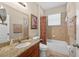 Cozy bathroom features a granite-topped vanity and shower-tub combination at 1556 Blue Grass Blvd, Deland, FL 32724