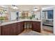 Bathroom with double vanity, granite countertops and dark wood cabinets at 1556 Blue Grass Blvd, Deland, FL 32724