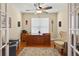 This office is filled with light thanks to the french doors and windows at 1556 Blue Grass Blvd, Deland, FL 32724