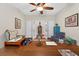Spacious bedroom has a ceiling fan and French doors at 1556 Blue Grass Blvd, Deland, FL 32724