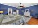 The primary bedroom features a walk-in closet and wood floors at 1556 Blue Grass Blvd, Deland, FL 32724