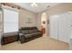Bedroom with comfy couch and white closet at 1556 Blue Grass Blvd, Deland, FL 32724