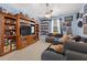 Spacious bedroom with a ceiling fan and custom display shelving at 1556 Blue Grass Blvd, Deland, FL 32724