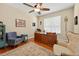 Bedroom features an office desk, ceiling fan, and neutral color palette at 1556 Blue Grass Blvd, Deland, FL 32724