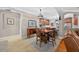 Dining area with wood table and chairs, open to the kitchen for easy entertaining at 1556 Blue Grass Blvd, Deland, FL 32724