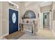 Welcoming foyer with tile flooring and a view of the entryway table at 1556 Blue Grass Blvd, Deland, FL 32724