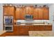 Custom kitchen featuring stainless steel appliances and sleek cabinets at 1556 Blue Grass Blvd, Deland, FL 32724