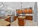 Well-lit kitchen with custom cabinets, dual islands and stainless steel appliances at 1556 Blue Grass Blvd, Deland, FL 32724